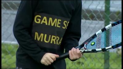 Young tennis player with 'Game set Murray' jumper