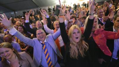 Supporters of Prime Minister Mark Rutte cheer result