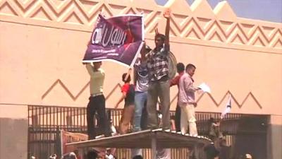 Protesters waving flags