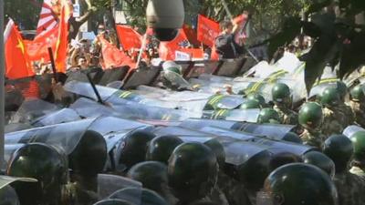 Police and demonstrators in Beijing