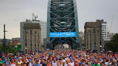 Runners cross the Tyne Bridge during the Great North Run