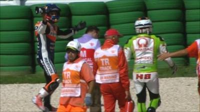 Dani Pedrosa walks away from his collision with Hector Barbera.