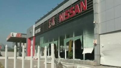 Damaged Nissan car showroom