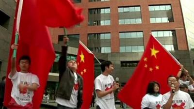 Protesters with Chinese flags