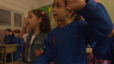 School children saluting