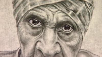 Drawing of a man with wrinkled face and piercing eyes