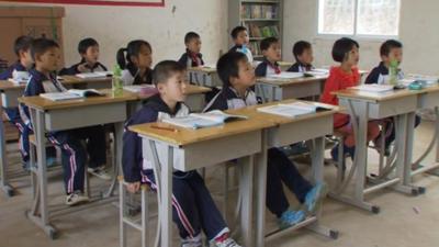 A Chinese classroom, where there are only two girls amongst twelve students