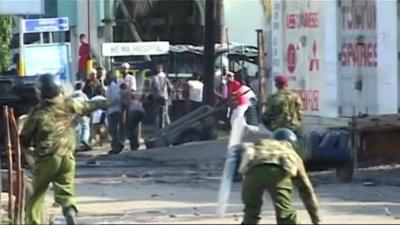 Kenyan rioters throwing missiles at security forces in August, who responded with tear gas and warning shots