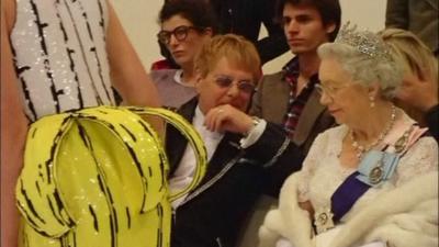 Queen and Elton John lookalikes view models on catwalk