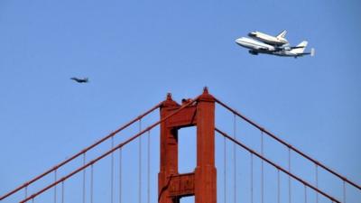Nasa's shuttle Endeavour flying piggy-back on a Boeing 747 over the Golden Gate Bridge in San Francisco