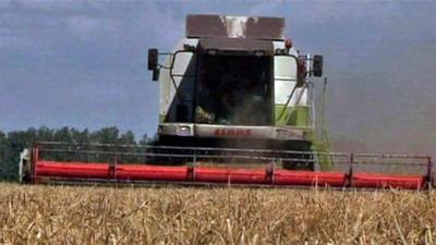 Harvester in field