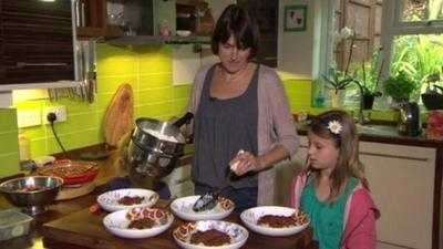 Natasha Hobbs and her daughter preparing food