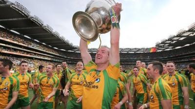 Neil Gallagher lifts the Sam Maguire cup at Croke Park