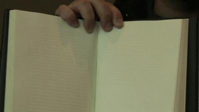 Partially faded ink on some pages of a book