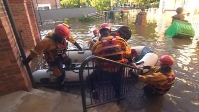 Rescue teams evacuate elderly residents' home