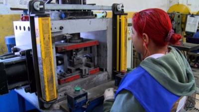 A worker in a Brazilian auto-parts factory