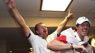 Graeme McDowell sings alongside Rory McIlroy in the lock room after the Ryder Cup triumph