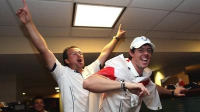 Graeme McDowell sings alongside Rory McIlroy in the lock room after the Ryder Cup triumph