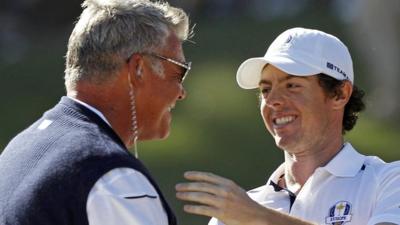 Darren Clarkes congratulates Rory McIlroy after his singles win over Keegan Bradley