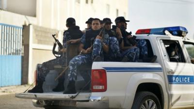 Hamas policemen guard outside a Gaza military court September 17, 2012