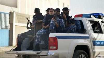 Hamas policemen guard outside a Gaza military court September 17, 2012