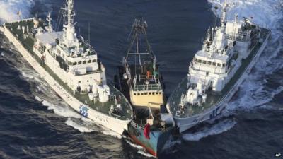 The Boa Diao boat, centre, is surrounded by Japan Coast Guard"s patrol boats after Hong Kong activists from Action Committee for Defending the Diaoyu Islands.