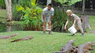 Robert Irwin feeding crocodiles