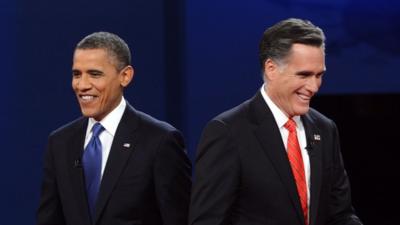 US President Barack Obama and Mitt Romney finish their debate at the University of Denver in Denver, Colorado, 3 October 2012