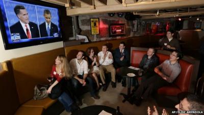 Members of the Massachusetts GOP Young Republicans react as they watch the first presidential debate