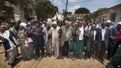 Kenyan Mau Mau war veterans and their supporters celebrate