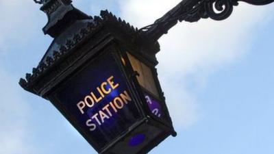 A blue lamp outside the Metropolitan Police Service police station