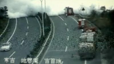 Smoke spreads after a tanker explosion on a major highway in Hunan province, China