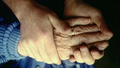 Elderly person and carer