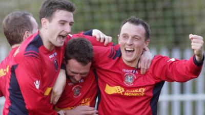 Lisburn Distillery players celebrate victory over Donegal Celtic