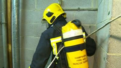 A firefighter caught in cables