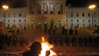 Fire burns in front of parliament in Lisbon