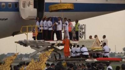 King Norodom Sihanouk's coffin being carried from a plane