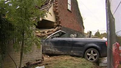 Car crashed into side of house