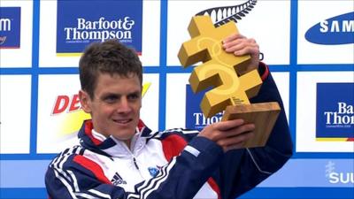 Jonny Brownlee lifts the trophy