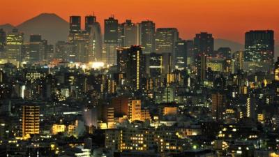 Mount Fuji behind the skyline of the Shinjuku area of Tokyo at sunset