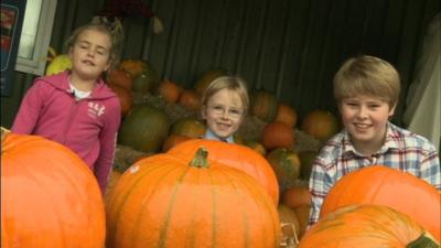 Children with their pumpkins.