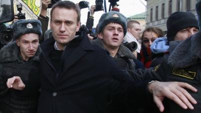 Russian opposition leader Alexei Navalny is detained by police during a protest march in Moscow October, 2012