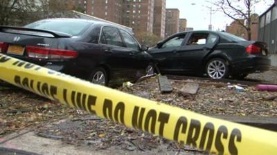 Two cars damaged by super-storm Sandy on Avenue C