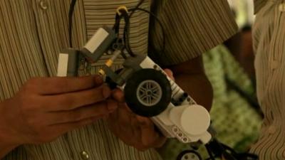 A Ghanaian student with lego robot