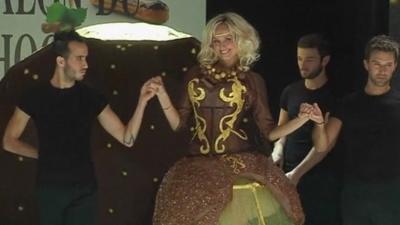 A model wearing a chocolate dress