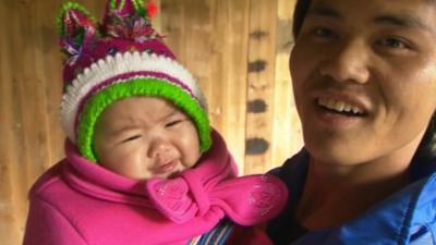 A man holding his one year old baby