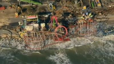 Aerial footage of funfair washed out to sea on the east coast of the US