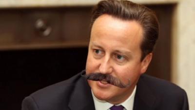 David Cameron with fake moustache