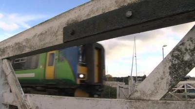 Train at level crossing