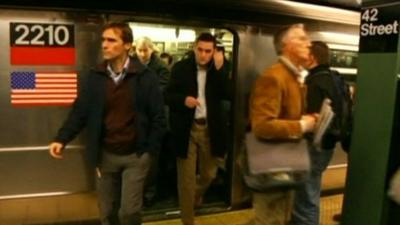 Commuters getting off New York subway at 42nd Street